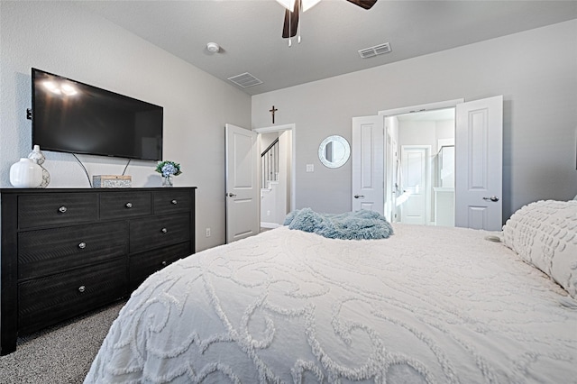 bedroom with ceiling fan, visible vents, ensuite bath, and carpet flooring