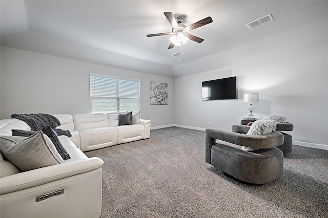 carpeted living room with visible vents, baseboards, ceiling fan, and vaulted ceiling