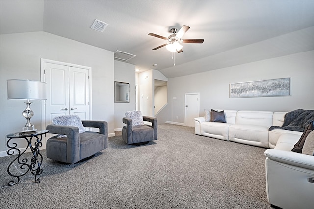 living room featuring visible vents, carpet, ceiling fan, and vaulted ceiling