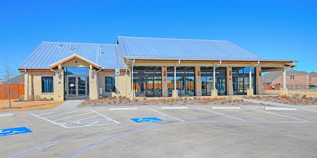 view of property featuring uncovered parking