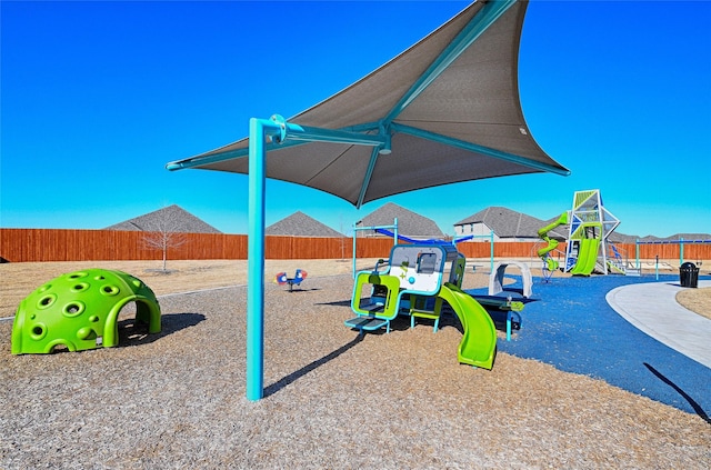 communal playground featuring fence