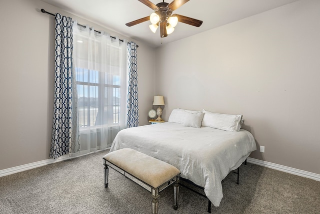 carpeted bedroom with baseboards and a ceiling fan