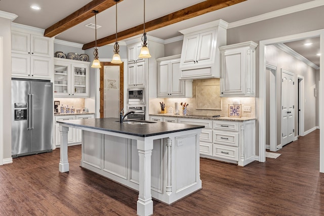 kitchen featuring appliances with stainless steel finishes, dark wood-type flooring, a sink, white cabinetry, and beam ceiling