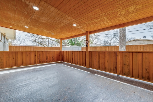 view of patio featuring an outdoor structure and a fenced backyard