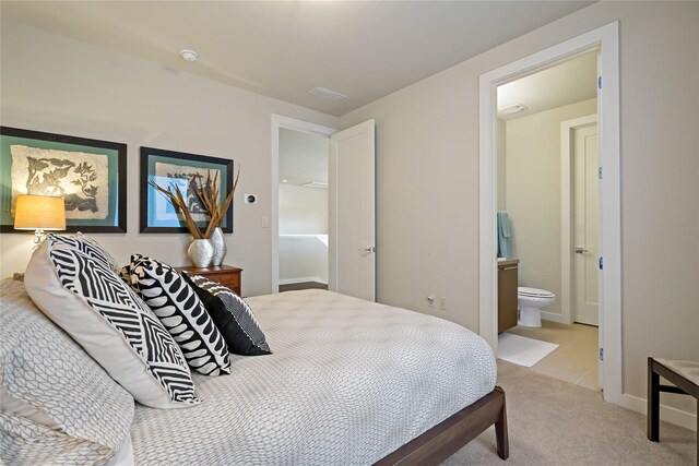 636 Benalla Dr, Frisco, TX 75036 - bedroom featuring light colored carpet, connected bathroom, and light tile patterned flooring