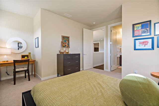 carpeted bedroom with visible vents and baseboards