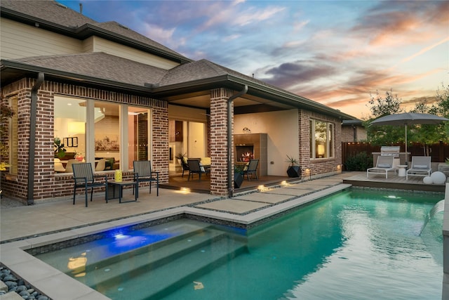 view of swimming pool with a fenced in pool and a patio area