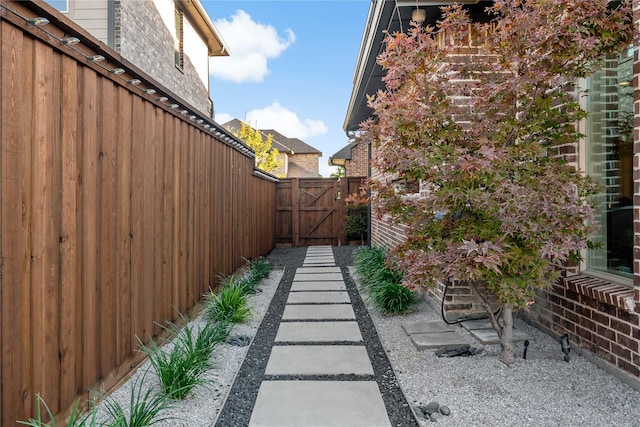 view of patio / terrace with fence and a gate