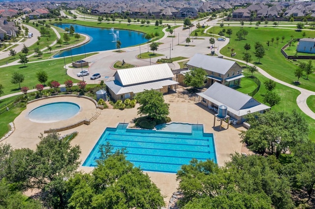 aerial view with a water view and a residential view