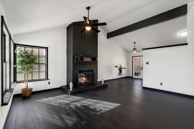 unfurnished living room featuring ceiling fan, baseboards, hardwood / wood-style floors, and a fireplace