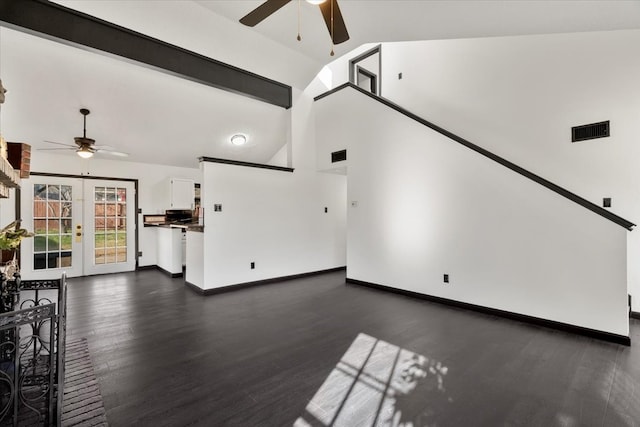 unfurnished living room featuring visible vents, baseboards, dark wood finished floors, french doors, and a ceiling fan