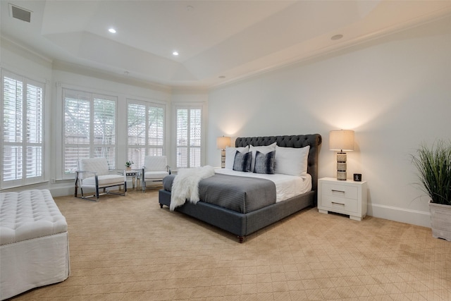 bedroom featuring recessed lighting, light carpet, visible vents, baseboards, and a tray ceiling