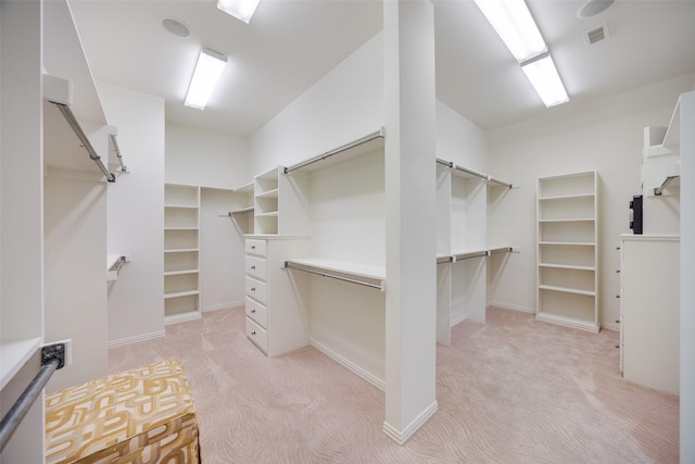 spacious closet with light carpet and visible vents