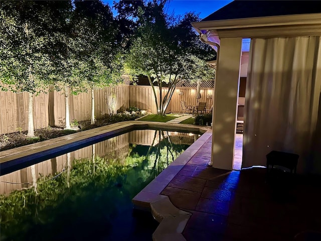 view of pool with a fenced in pool, fence, and a patio