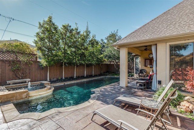 view of swimming pool with a fenced backyard, a ceiling fan, a fenced in pool, and a patio