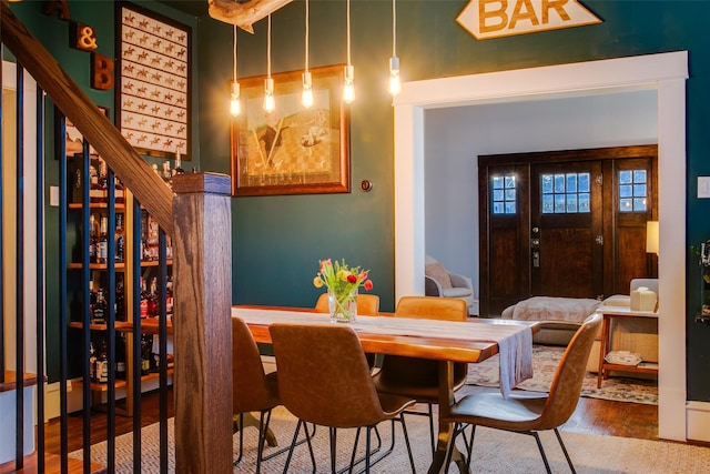 dining area featuring stairway and wood finished floors