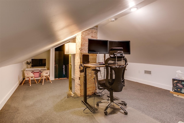 carpeted office space featuring baseboards, lofted ceiling, and visible vents