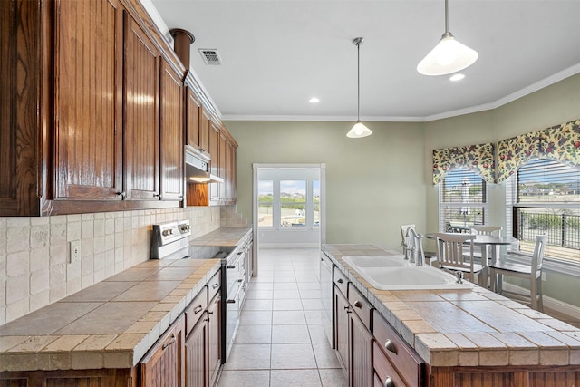 kitchen featuring visible vents, range with electric cooktop, ornamental molding, and a sink