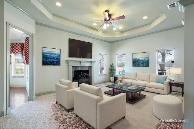 2118 Darby Dan Ct, Granbury, TX 76049 - living room featuring a tile fireplace, ceiling fan, healthy amount of natural light, recessed lighting, and a tray ceiling