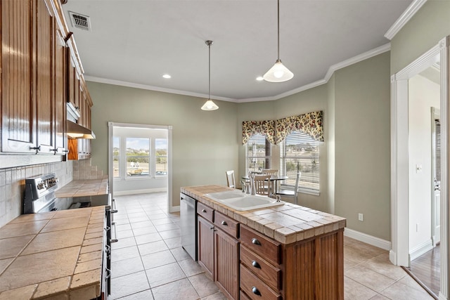 kitchen featuring visible vents, tile counters, under cabinet range hood, dishwasher, and a sink