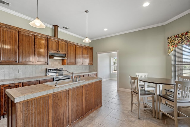2118 Darby Dan Ct, Granbury, TX 76049 - kitchen featuring under cabinet range hood, stainless steel electric range, backsplash, a sink, and light tile patterned floors