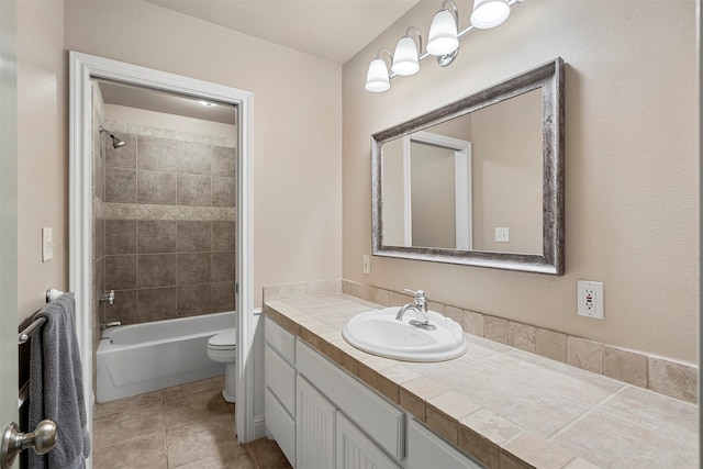 bathroom with vanity, tile patterned floors, toilet, and shower / bath combination