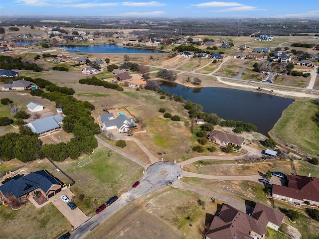 bird's eye view with a residential view and a water view