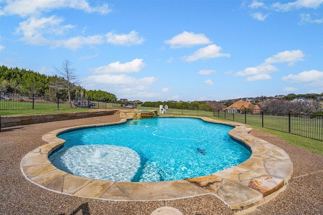 view of swimming pool featuring a yard, a pool with connected hot tub, a fenced backyard, and a patio area