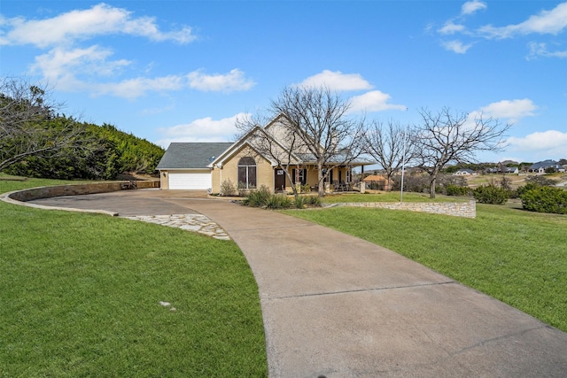 view of front of property with a porch, an attached garage, driveway, and a front yard