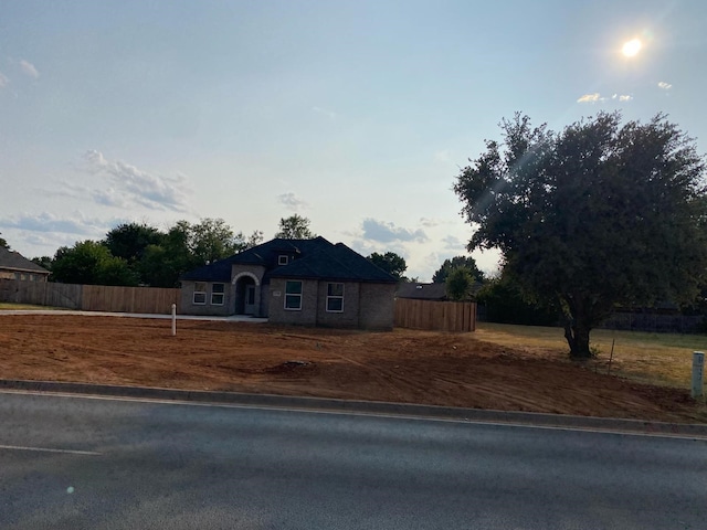 view of front of house with fence