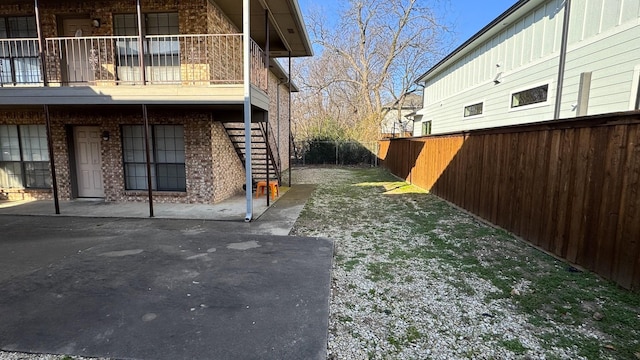 exterior space with fence and stairway