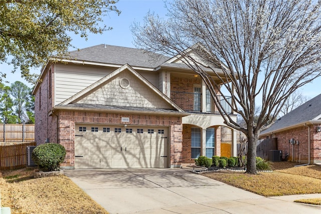 view of front of house featuring a balcony, fence, concrete driveway, central air condition unit, and brick siding