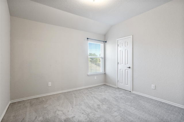 1503 Norway Pine St, Arlington, TX 76012 - carpeted spare room with vaulted ceiling and baseboards