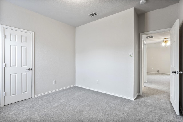 1503 Norway Pine St, Arlington, TX 76012 - unfurnished bedroom with carpet floors, baseboards, and a textured ceiling