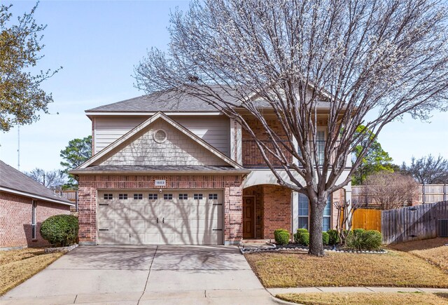1503 Norway Pine St, Arlington, TX 76012 - view of front of home featuring fence, concrete driveway, brick siding, and a garage