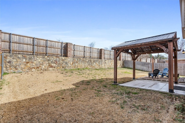 view of yard featuring a gazebo, a patio, and a fenced backyard