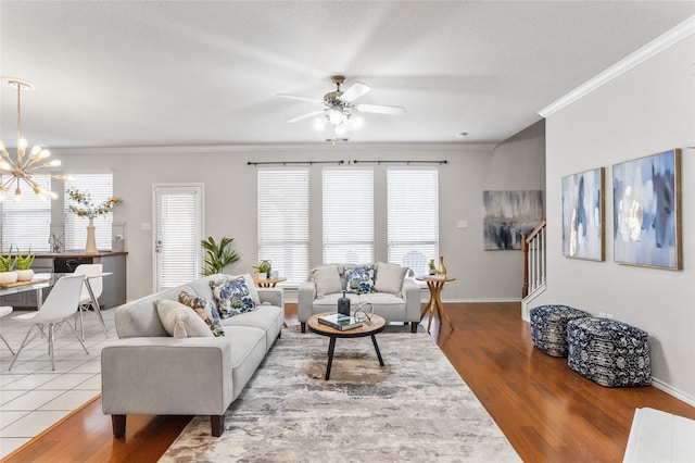 1503 Norway Pine St, Arlington, TX 76012 - living area featuring ceiling fan, wood finished floors, stairway, crown molding, and a chandelier