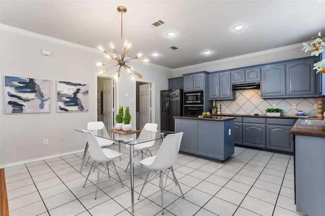 kitchen featuring stainless steel microwave, visible vents, oven, and refrigerator with ice dispenser