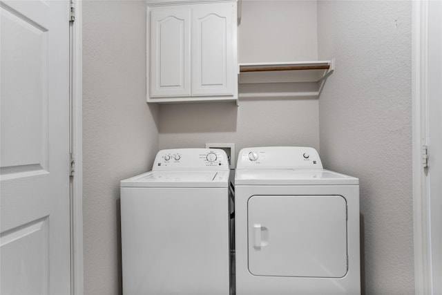 1503 Norway Pine St, Arlington, TX 76012 - laundry area with cabinet space, separate washer and dryer, and a textured wall