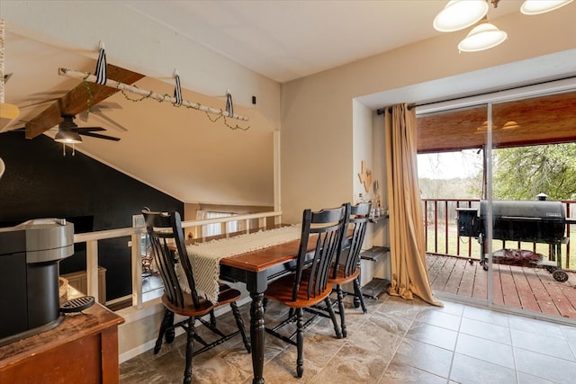 dining area featuring lofted ceiling