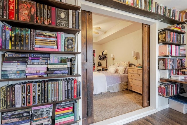 bedroom featuring baseboards and wood finished floors