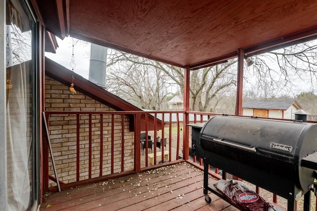 wooden deck featuring area for grilling