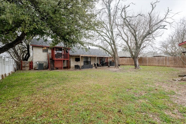 view of yard featuring a fenced backyard, stairway, cooling unit, and a wooden deck