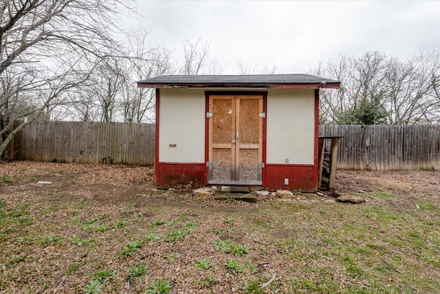 view of shed with a fenced backyard