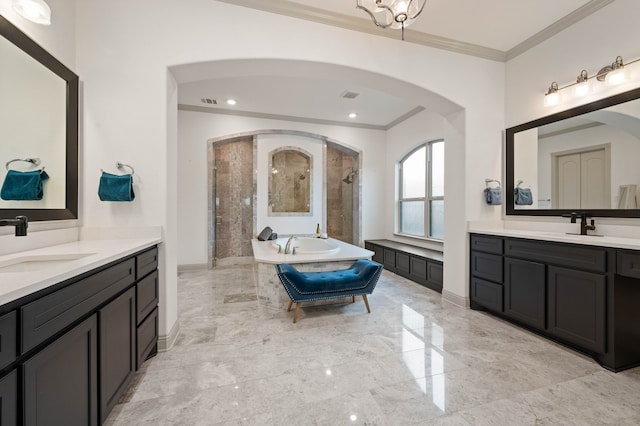 bathroom with a sink, marble finish floor, walk in shower, a bathtub, and crown molding