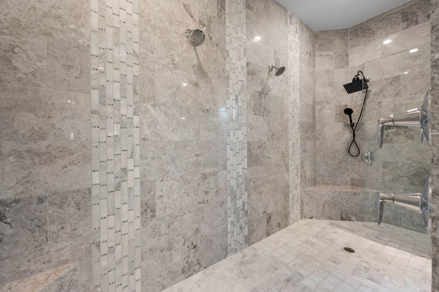 bathroom with tiled shower