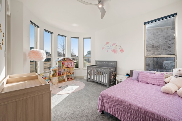 carpeted bedroom featuring ceiling fan