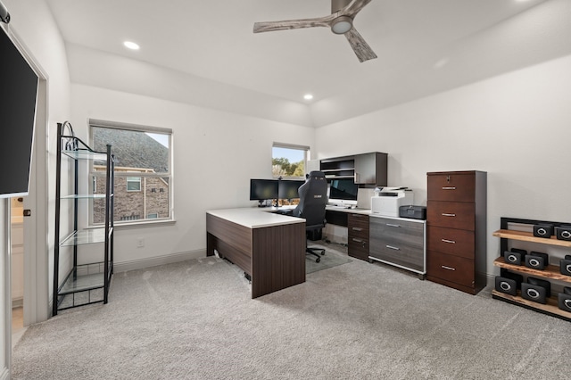 home office with lofted ceiling, recessed lighting, light carpet, ceiling fan, and baseboards