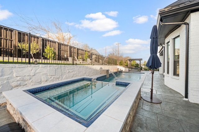 view of swimming pool featuring an in ground hot tub, a fenced backyard, and a fenced in pool