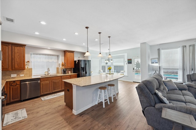 3532 Delaney Dr, Fort Worth, TX 76244 - kitchen with open floor plan, dishwasher, black fridge with ice dispenser, a sink, and recessed lighting